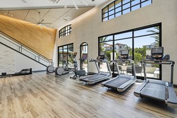 24-Hour fitness club with state-of-the-art fitness equipment including free weights